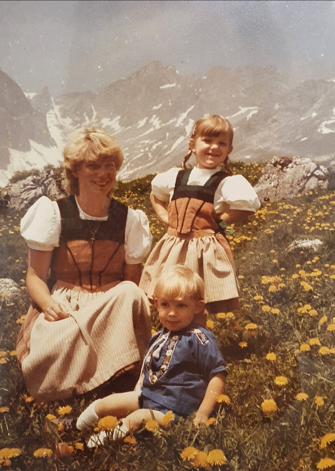 Andrea as a child with her mother and younger brother in the Swiss mountains